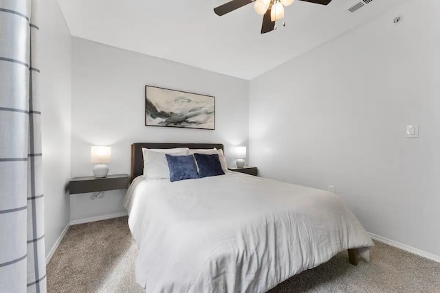 bedroom with ceiling fan, light colored carpet, and lofted ceiling