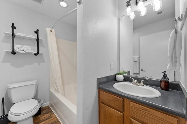 full bathroom featuring vanity, wood-type flooring, toilet, and shower / bath combo with shower curtain