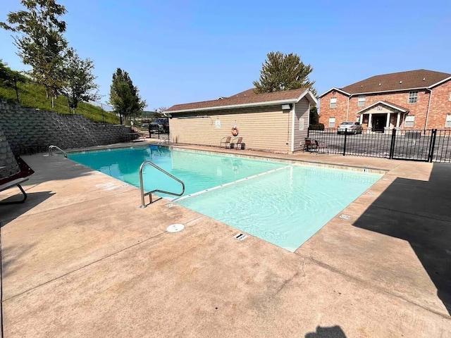 view of swimming pool with a patio area