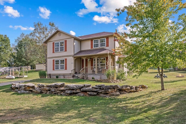 view of front of house with a porch and a front lawn