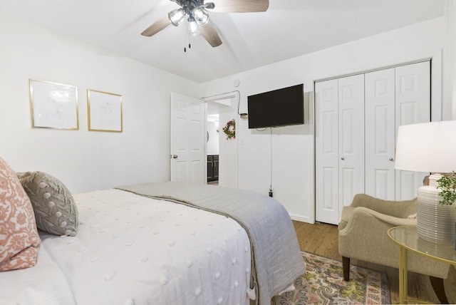 bedroom with wood-type flooring, a closet, and ceiling fan