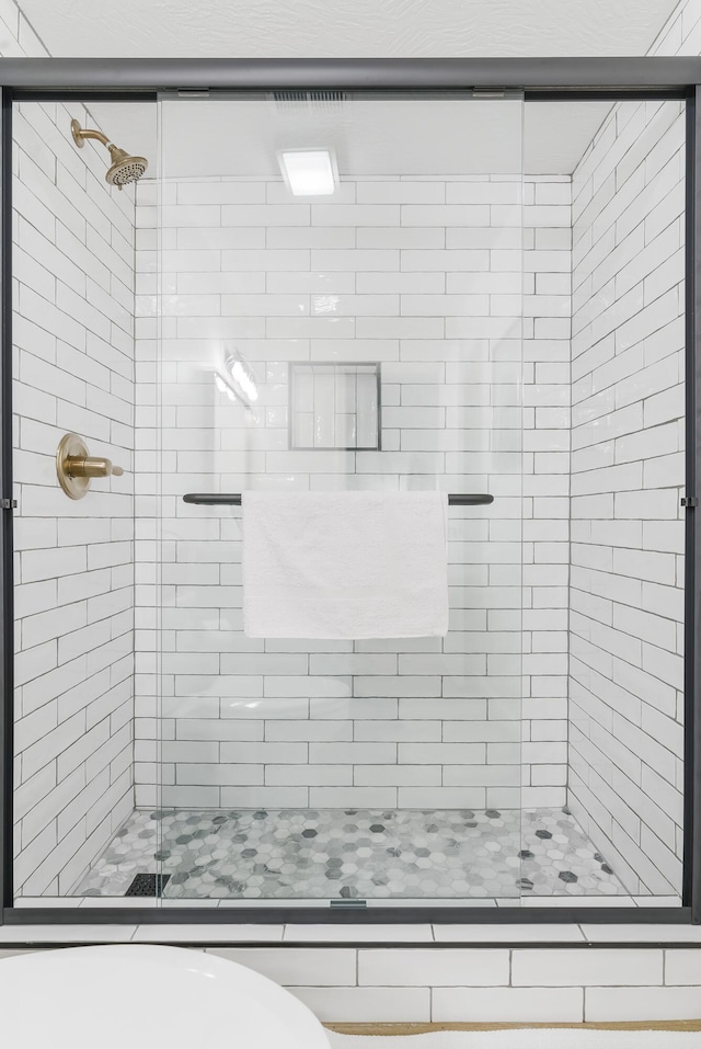 bathroom featuring an enclosed shower