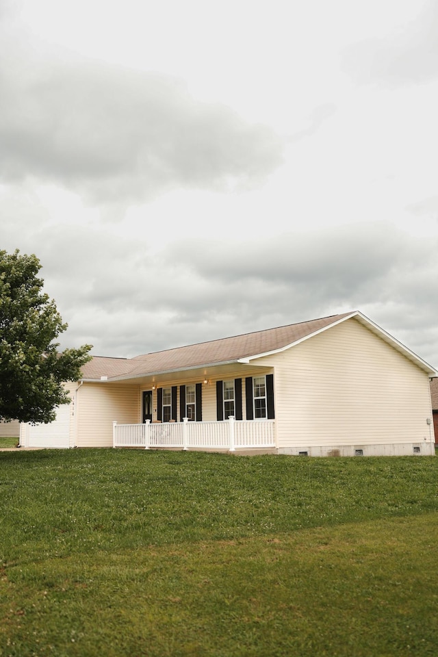 1610 Jon St, West Plains, MO 65775 - rear view of property featuring a porch, a yard, crawl space, and an attached garage