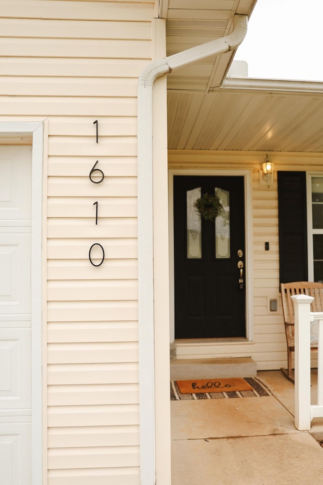 1610 Jon St, West Plains, MO 65775 - doorway to property with covered porch