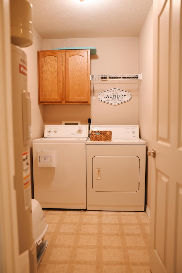 1610 Jon St, West Plains, MO 65775 - washroom with cabinet space, independent washer and dryer, water heater, and light flooring