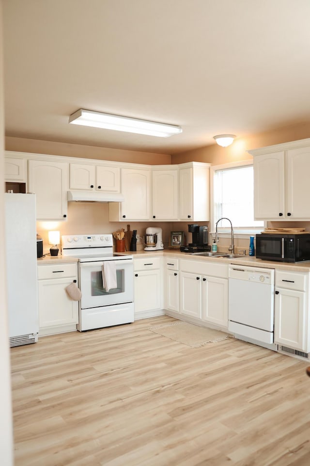 1610 Jon St, West Plains, MO 65775 - kitchen with white appliances, a sink, white cabinetry, light wood-type flooring, and light countertops