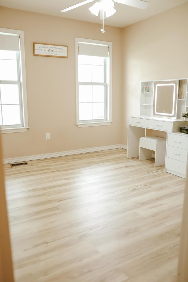 1610 Jon St, West Plains, MO 65775 - unfurnished office featuring a ceiling fan, wood finished floors, and baseboards