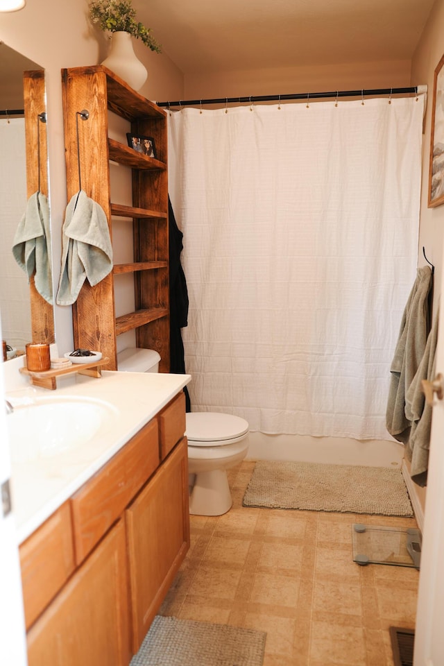 1610 Jon St, West Plains, MO 65775 - bathroom featuring toilet, vanity, and tile patterned floors