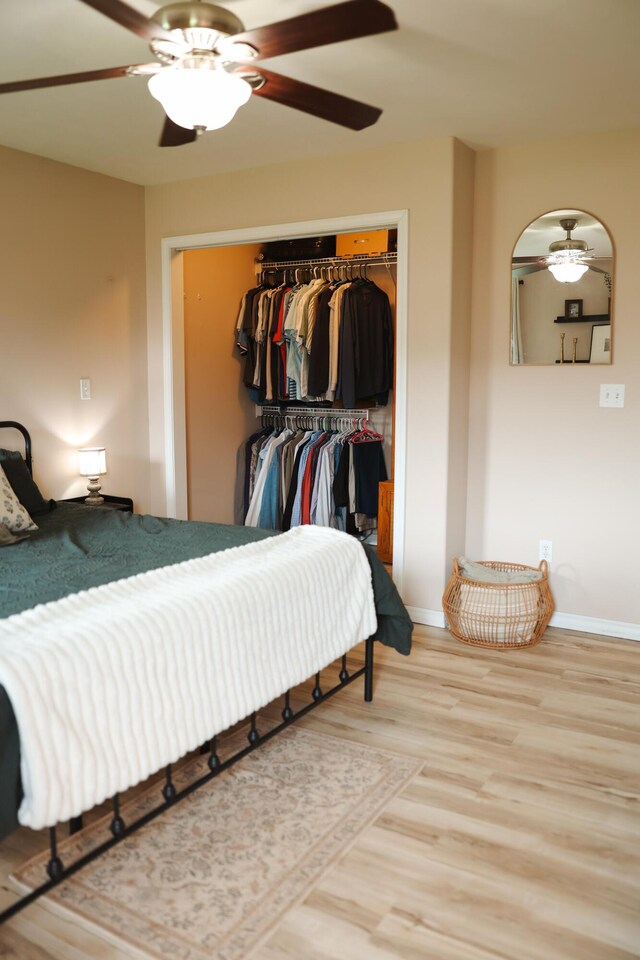 1610 Jon St, West Plains, MO 65775 - bedroom with wood finished floors, a closet, baseboards, and ceiling fan