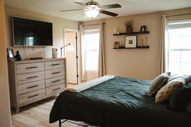 1610 Jon St, West Plains, MO 65775 - bedroom with light wood-style floors and ceiling fan