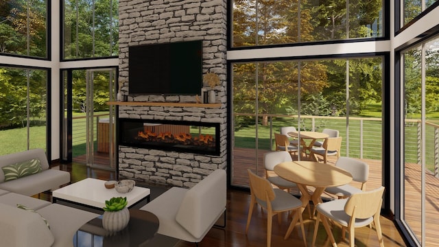 sunroom featuring a fireplace