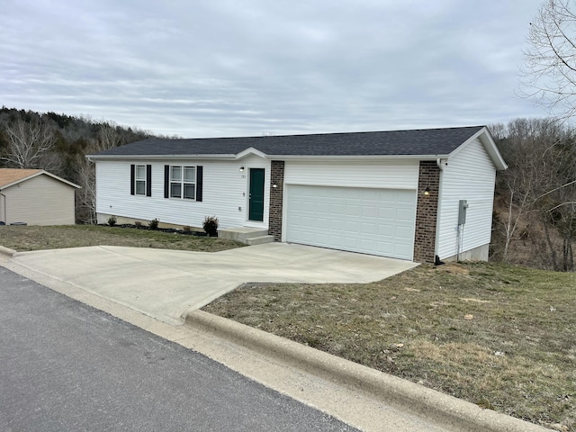 view of front of home featuring a garage and a front lawn