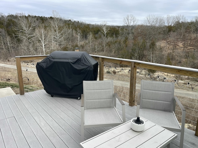 wooden terrace featuring grilling area