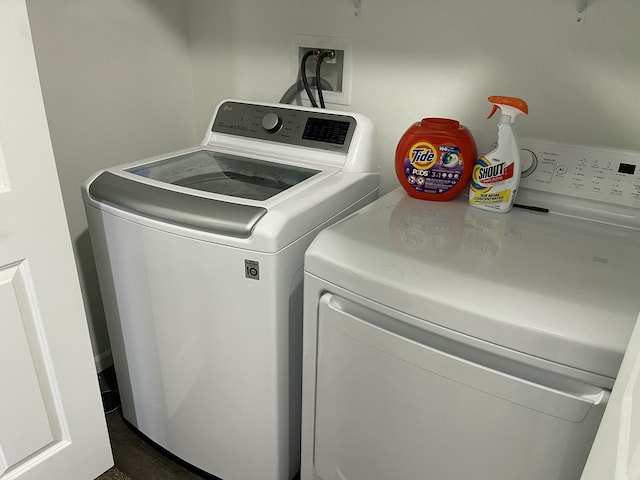 laundry area with washing machine and clothes dryer