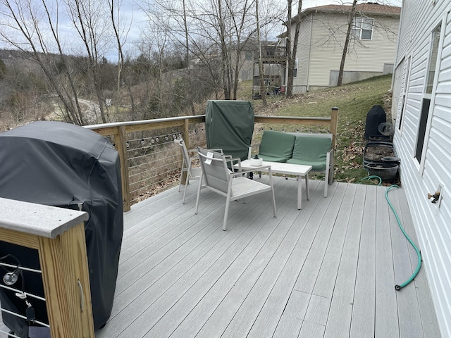 deck with area for grilling and an outdoor hangout area