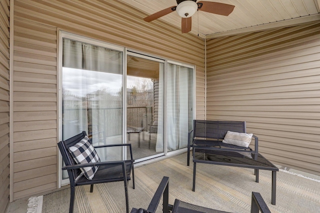 exterior space featuring ceiling fan