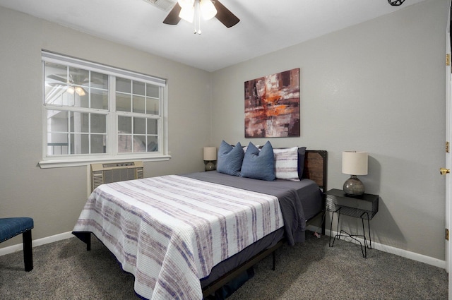 bedroom with ceiling fan, dark carpet, and a wall mounted AC