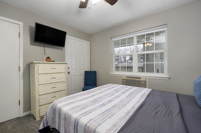 bedroom featuring a wall mounted air conditioner, carpet floors, and ceiling fan