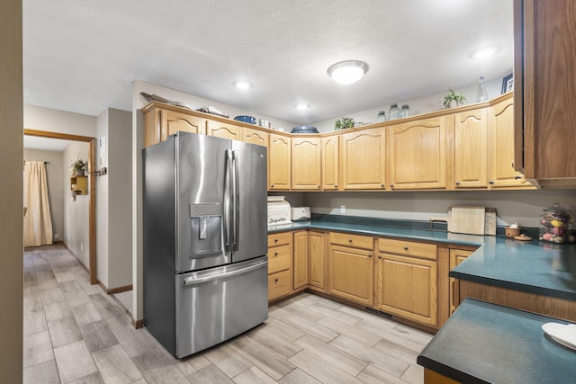 kitchen with stainless steel fridge with ice dispenser