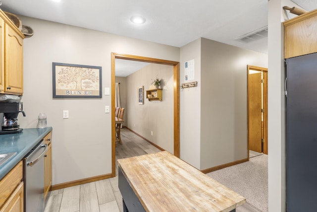 kitchen featuring wooden counters, dishwasher, and light brown cabinets