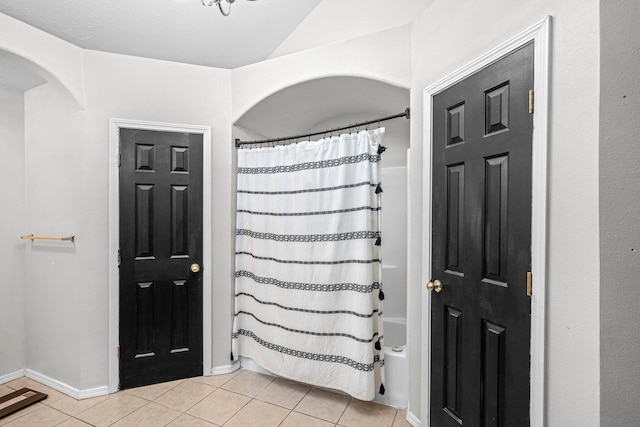 foyer entrance with light tile patterned floors