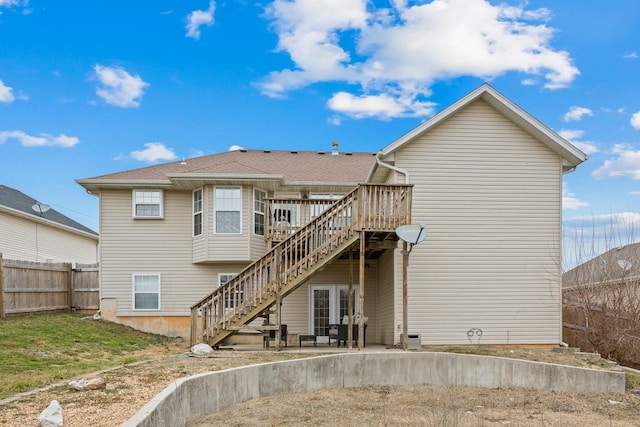 rear view of property featuring a deck