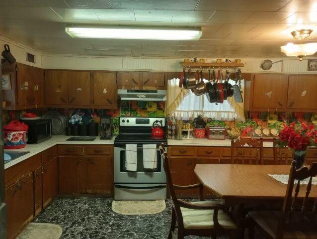 kitchen with stainless steel range with electric stovetop