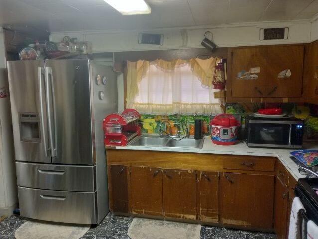 kitchen featuring stainless steel appliances and sink