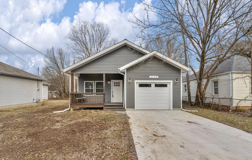 view of front of home with a garage and covered porch