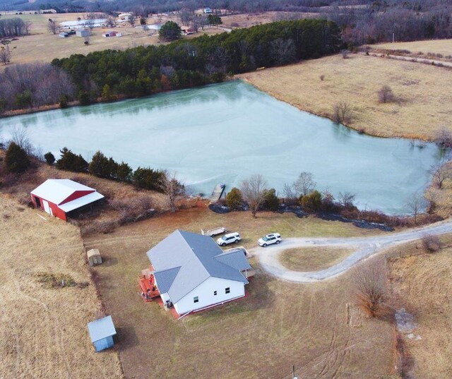 birds eye view of property with a water view and a rural view
