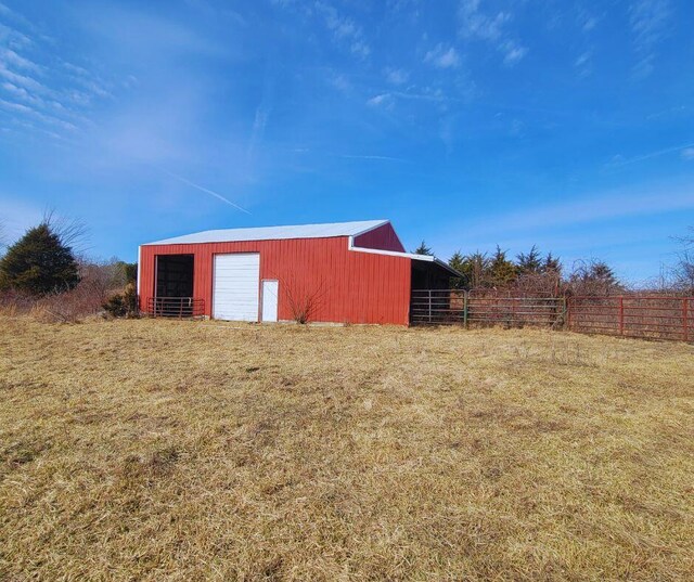 view of outbuilding featuring a yard