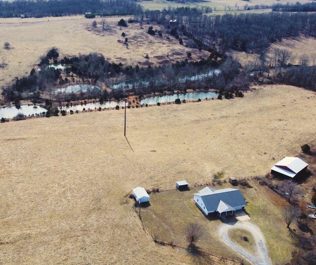 birds eye view of property featuring a rural view