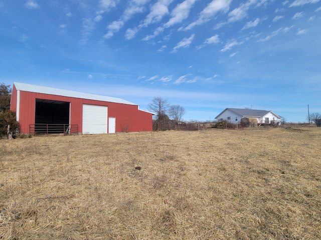 view of yard with an outbuilding and a garage