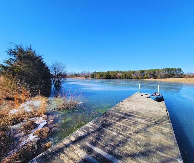 view of dock with a water view