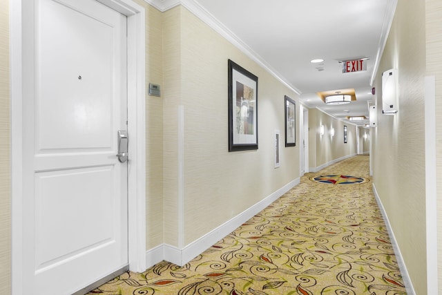 hallway featuring ornamental molding and light tile patterned floors