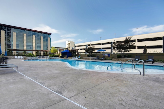 view of pool featuring a patio