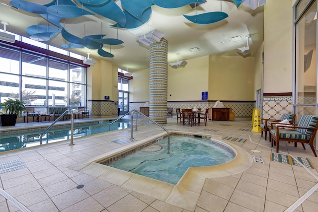 view of swimming pool featuring an indoor hot tub