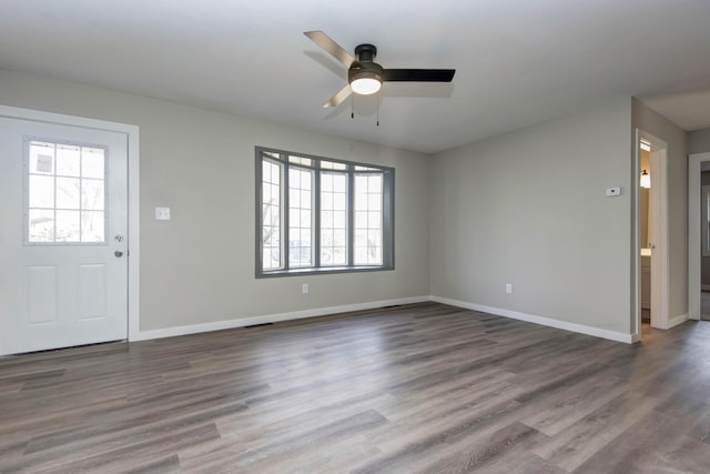 entrance foyer with wood finished floors, baseboards, and a ceiling fan