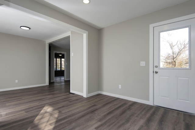 foyer featuring dark wood-type flooring, baseboards, and recessed lighting