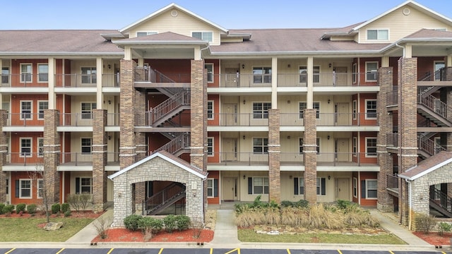 view of property featuring uncovered parking