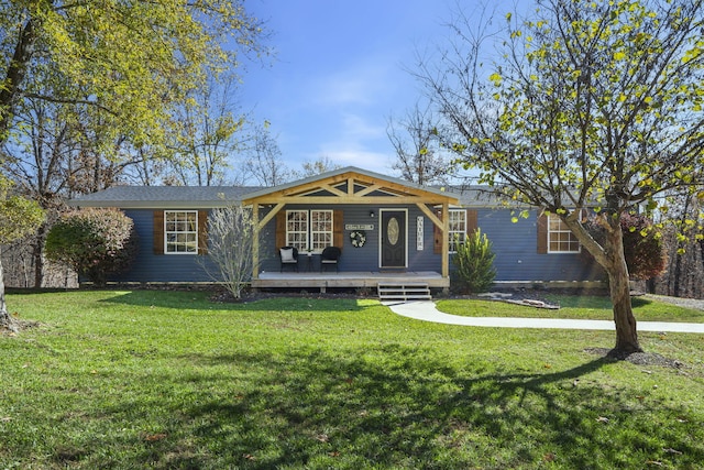 ranch-style house with a front yard and covered porch