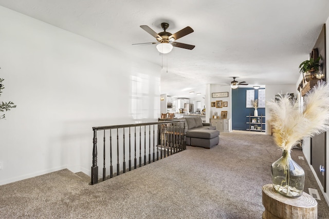 living room with carpet floors and ceiling fan