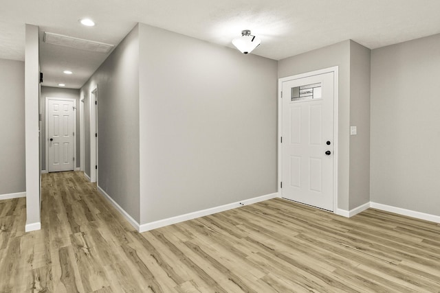 foyer with light hardwood / wood-style flooring