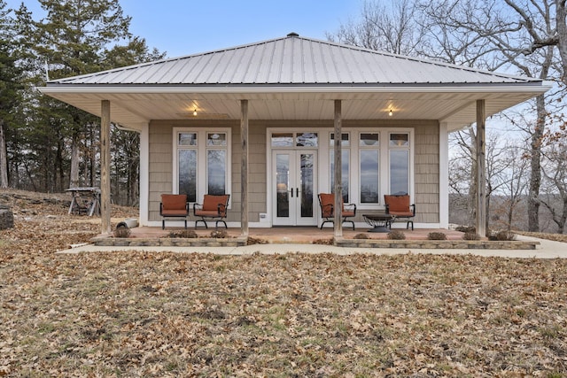 back of house with french doors and a porch