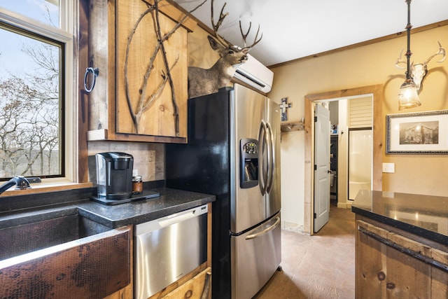 kitchen featuring appliances with stainless steel finishes, decorative light fixtures, sink, crown molding, and a wall unit AC