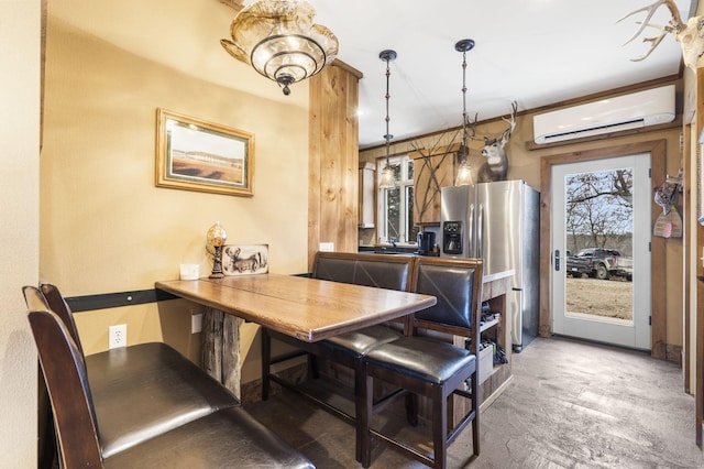 dining space featuring a wall unit AC