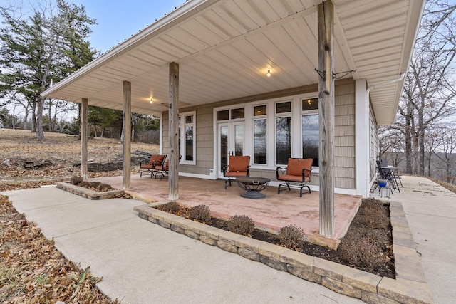 view of patio / terrace with a fire pit