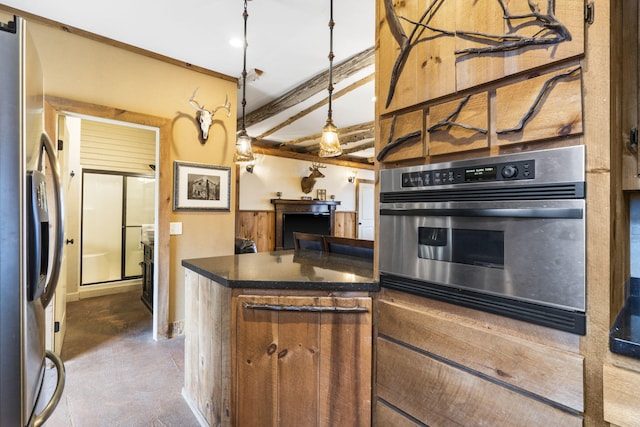 kitchen with decorative light fixtures, stainless steel appliances, and beamed ceiling