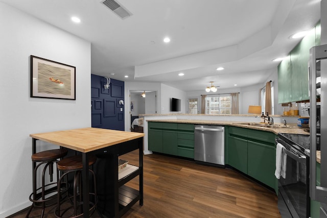 kitchen featuring dark hardwood / wood-style floors, dishwasher, black electric range oven, sink, and green cabinetry