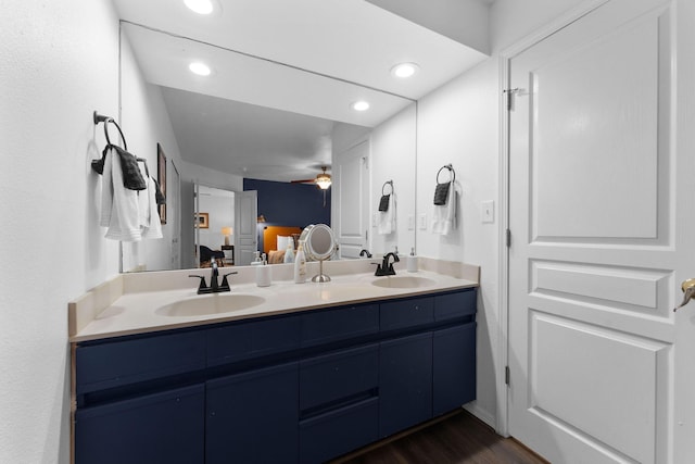 bathroom with vanity, wood-type flooring, and ceiling fan